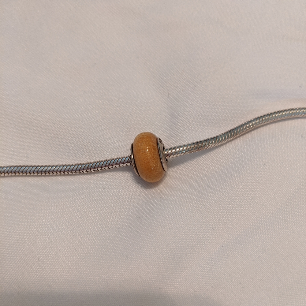 Gold wood Pandora charm